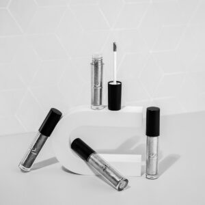 3 black and silver tube bottles